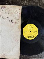 Record with a stained and worn cover showing yellow label 'Humorsonic Records' by Nipsey Russell Comedy Sampler.