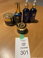 Photo of Elizabeth Grant Wonder Effect skincare products arranged on a table showing jars and two dropper bottles.