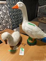 Photo showing My Duck plush puppet and Loie Duck table lamp on table