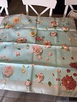 Full view of square silk scarf laid flat