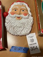 Front view of Santa Claus wall decoration showing detailed facial features, beard, and hat