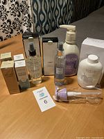 Photo showing all toiletry products, arrangement on table with label card 6