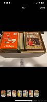 View of boxed collection with visible book spines including 'Green Eggs and Ham' and 'Little Black A Pony'