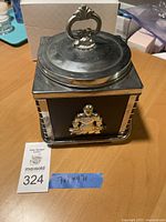 Full view of square ice bucket with lid and ornate chrome handle, displaying size and overall condition.