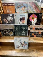 Photo showing full collection of ten Dave Brubeck jazz album covers arranged on stairs.