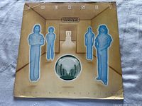 Front cover of 'Look Into The Future' album showing band members with blue haze on tan background. "Columbia" label noted.