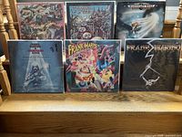 Front view of 6 vinyl record covers featuring rock albums by Frank Marino & Mahogany Rush, showing visible wear on covers.