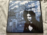 Front cover of Jack White Blunderbuss vinyl album showing black and white portrait of Jack White, shrink wrapped.