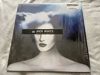 Front cover of vinyl album 'Boarding House Reach' by Jack White showcasing stylized monochrome female portrait with red lips and blue cloud effects, sealed in shrink wrap.
