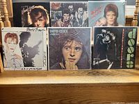 Front view of all six vinyl record covers, showing front artwork for David Bowie (four albums), David Essex, and The Doors.
