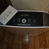 Top view showing the control panel of the Alen BreatheSmart FLEX air purifier with labeled buttons.