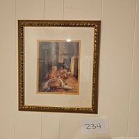 Front view of framed artwork showing a mother holding a child in a warm, dimly lit interior scene