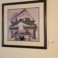 Full view of framed painting showing child playing grand piano with wooden frame and white mat.