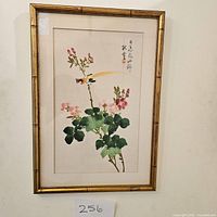 Frontal photo of the framed artwork showing a bird and flower painting with Asian calligraphy.