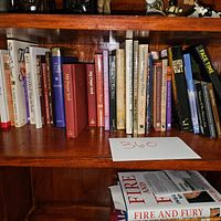 Shelf showing a variety of religious and spiritual books, including My Prayer Book, The Bible Promise Book, and other devotional titles.