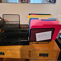 Full set showing black mesh desk organizer with multiple compartments and a black mesh vertical file holder with colorful folders on a wooden surface.