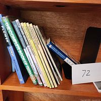 Books on shelf showing flower, garden and plant related titles