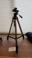 Full view of Giottos VT808 tripod, showing tripod legs extended and pan handle attached