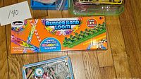 Photo showing LaRose Rubber Band Loom Kit box and Alex Watch Kit in metal tin.