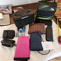 Overview of all bags and pouches displayed on a table showing variety and quantity