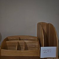 Wooden horizontal desk organizer with multiple compartments photographed from the front showing six separate sections.