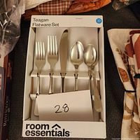 Photo of the boxed Teagan 20-piece flatware set by Room Essentials showing forks, knives, spoons, and teaspoons in their original packaging.