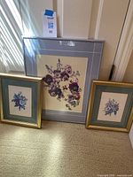 Three framed floral pictures displayed, showing overall size and framing.