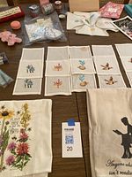 Various crafting and art items arranged on table, markers presumably included in the lot