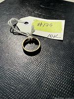 View of the 10K gold band ring tagged #174