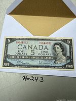 Front of 1954 Canadian $5 banknote showing Queen Elizabeth II portrait and serial number in good condition.