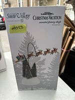 Original boxed Dept. 56 Snow Village National Lampoon's Christmas Vacation animated flaming sleigh with Santa and reindeer.