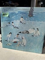 Photo of the Elton John Blue Moves vinyl album cover showing design and wear