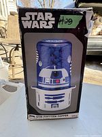 Photo of the popcorn popper box showing R2-D2 themed design on the product and branding information