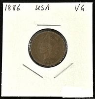 Obverse side of 1886 US Indian Head 1 Cent coin showing profile of Lady Liberty wearing Native American headdress, date 1886 visible, in white paper holder.