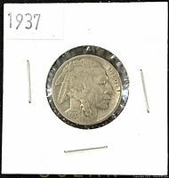 Obverse side of 1937 Buffalo Nickel showing Native American portrait, dated 1937.