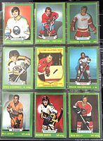 Front side of nine 1973-74 O-Pee-Chee NHL hockey cards showing various players in jerseys with colorful borders.