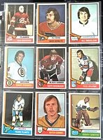 Complete view of nine 1974-75 O-Pee-Chee NHL hockey trading cards showing front player images and team logos.