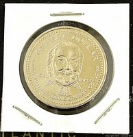 Obverse side of the coin showing portrait of Gilbert Dollar with inscriptions and date 1983