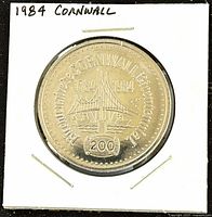 Obverse side of the 1984 Canadian Cornwall Ontario Trade Dollar Coin featuring a bridge and '200' marking.
