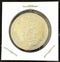 Front side of the coin showing St. Thomas Ontario Canada coat of arms and text.