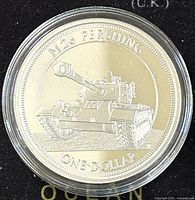 Obverse side of 2017 Tuvalu M26 Pershing proof coin showing M26 Pershing tank and denomination one dollar, housed in clear protective capsule.
