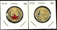 Front and back of 2020 and 2023 Canadian colourized Loonie coins showing detailed designs in holders