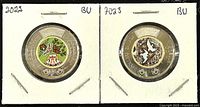 Front and back view of 2022 and 2023 Canadian colored Twoonie coins, showing colorized design and Queen Elizabeth II effigy.