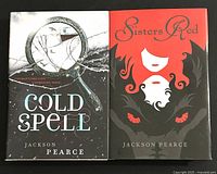 Front covers of the two Jackson Pearce novels, Cold Spell and Sisters Red, showing their illustrated dust jackets and titles.
