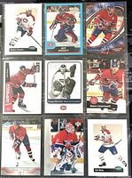 Nine Montreal Canadiens player hockey trading cards in sleeves, front view.