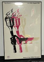 Framed 1984 Los Angeles Olympic Games poster featuring the torch symbol with flame in black, red, and gold, listing event dates July 28th-August 12th.