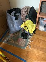 Gray bag labeled 'King Mattress' containing a king-size air mattress.