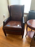 Front view of entire recliner showing upholstery, armrests and seat cushion