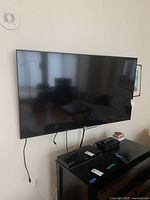 Wall-mounted TV, front view