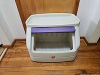 Front open view of the Step2 plastic toy box showing interior storage space and purple lid in open position.